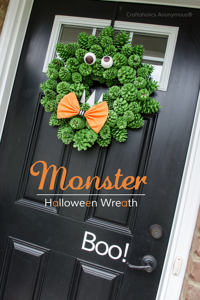 Pinecone monster Halloween Wreath idea. Super cute and easy DIY wreath! The texture is awesome.