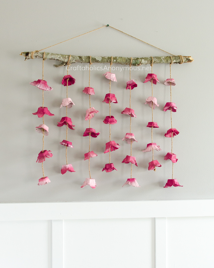 DIY Flower Wall hanging craft idea. The flowers are made from Egg Cartons. So cool and so pretty!