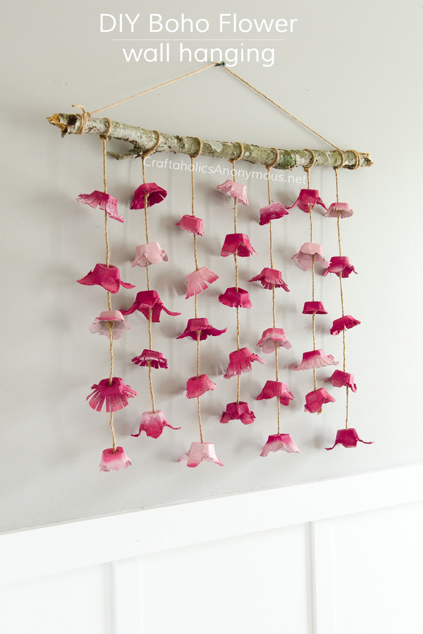 DIY Boho Flower Wall hanging craft idea. Cheap to make! All you need is 3 egg cartons and a stick!