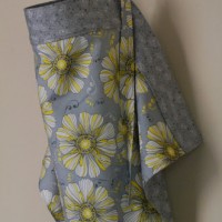 gray and yellow nursing cover