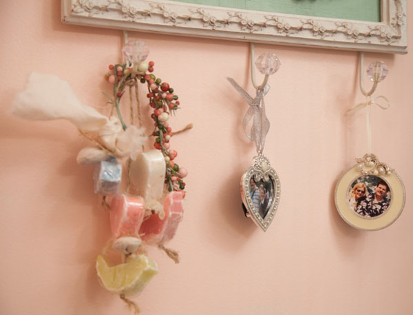 Hanging fragrant soaps and photos of her husband add personal touches to this craft room.