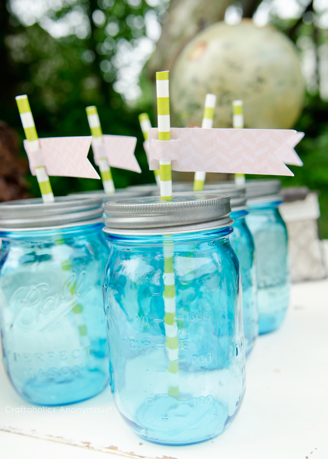 blue mason jar drinks with paper straws. Love the colors she used!
