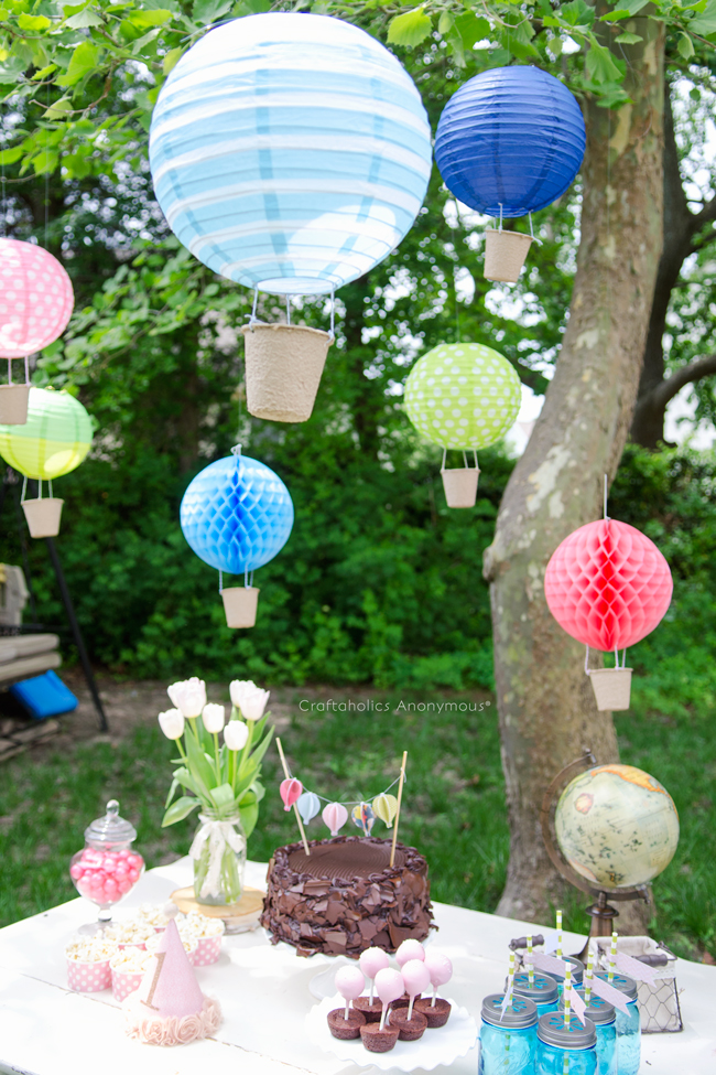 Hot air balloons made from paper lanterns. Such a neat idea! Love this whole party.