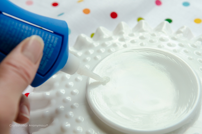apply super glue to plate. She recommends which type works best.