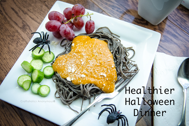 Healthier Halloween dinner idea - witch hair pasta with pumpkin sauce, mummy toes, and snake slices.