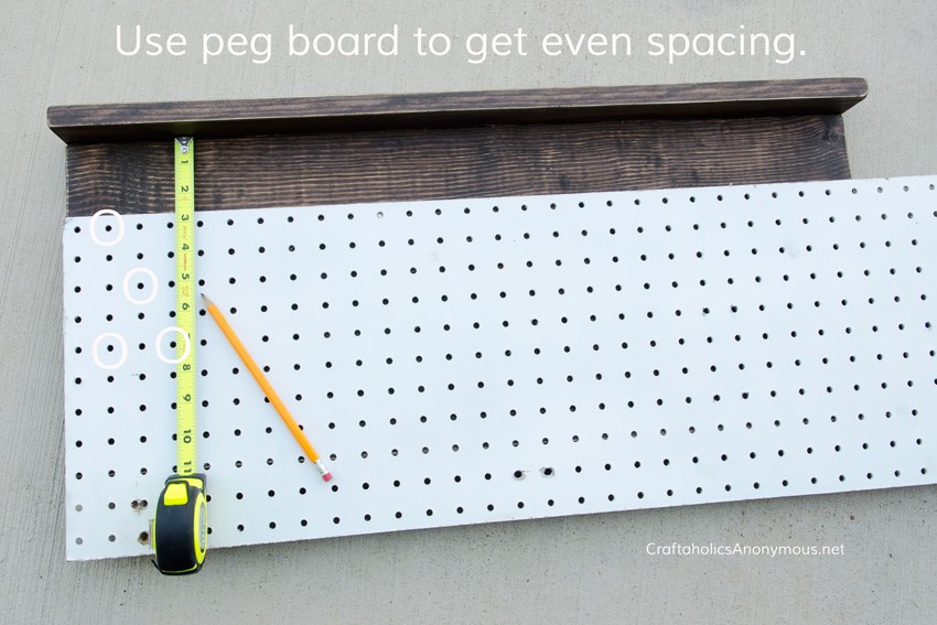 DIY Tie Rack || Use pegboard as a guide to evenly mark where each nail goes 