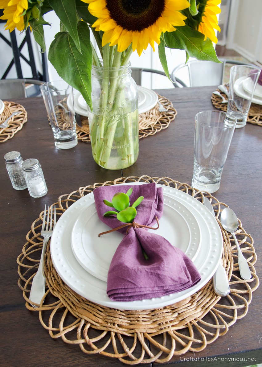 Giant sunflowers in a mason jar is the perfect centerpiece for a Fall Tablescape!