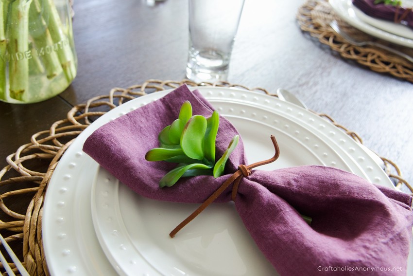 Slip a faux succulent into the napkin for a pop of color