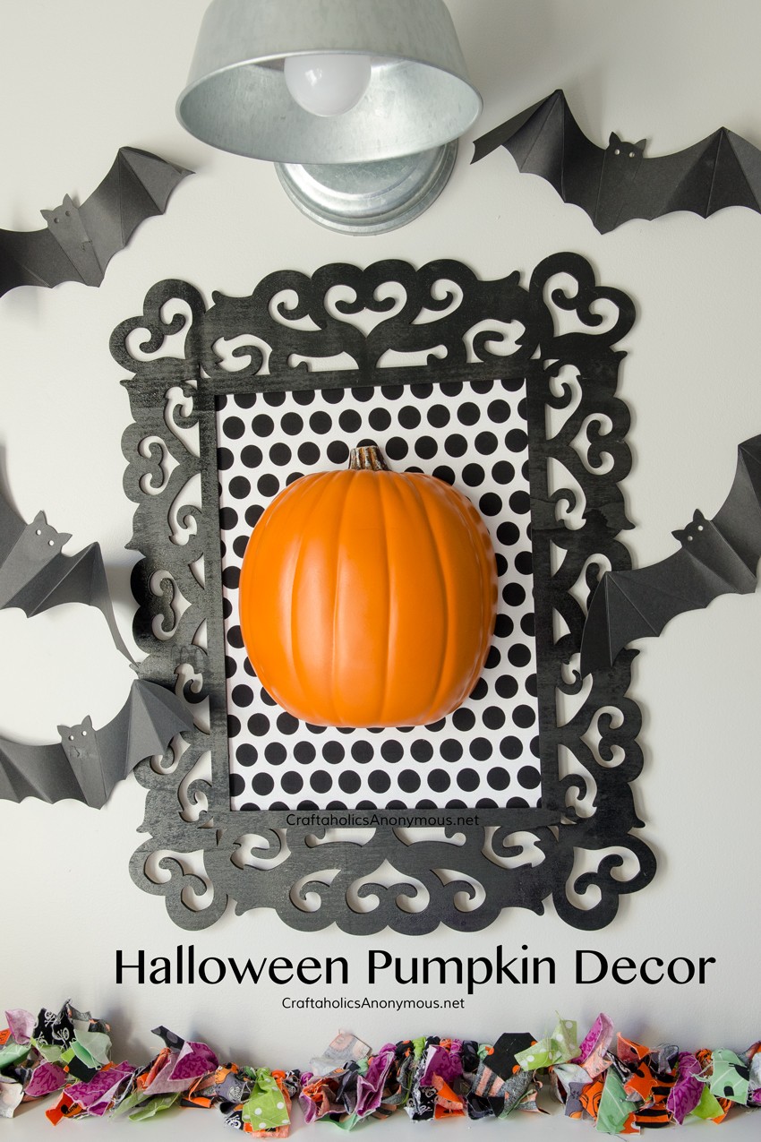 DIY Framed Halloween Pumpkin Decor Tutorial || Could use black and white damask fabric with a white pumpkin for a gothic look.