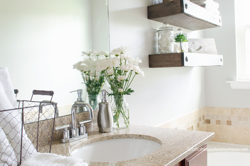 DIY Bathroom makeover || loving those floating shelves!