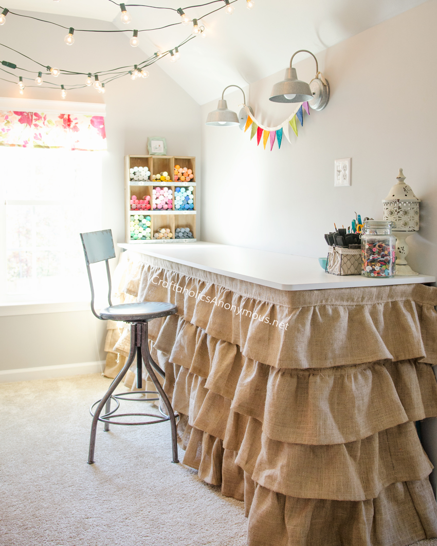 Craft Room desk with ruffled burlap skirt. Great idea to hide storage underneath the desk. Take a tour of the Dream Craft Room www.craftaholicsanonymous.net