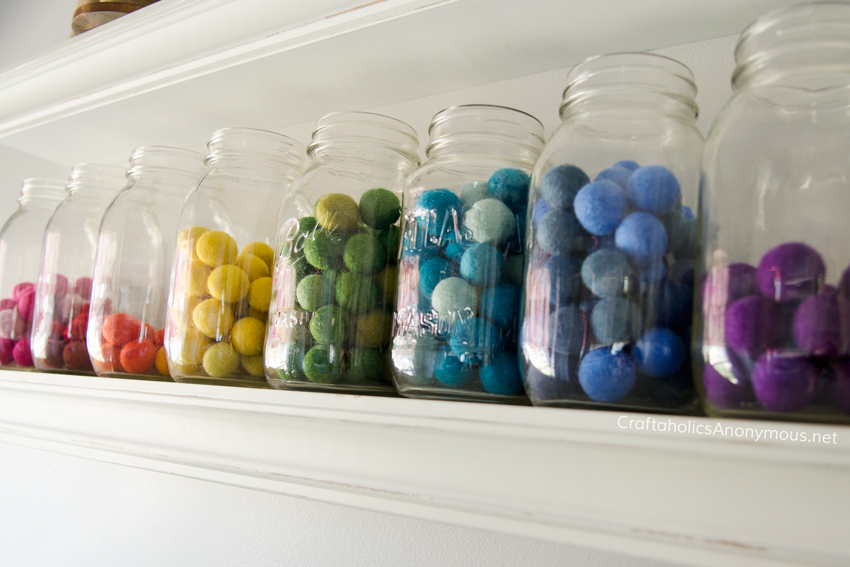 Store felt balls in mason jars + lots of craft room storage ideas on www.CraftaholicsAnonymous.net