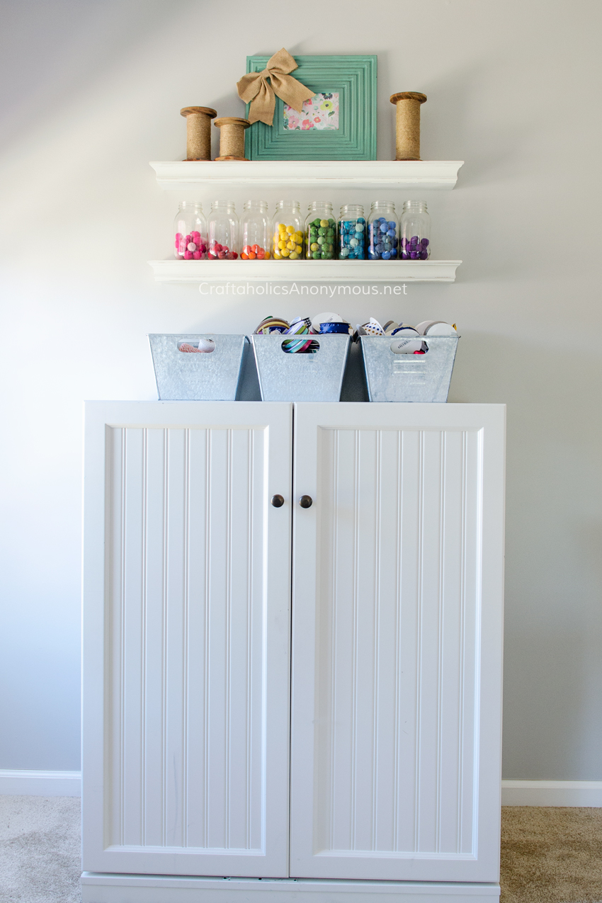 Sewing Cabinet in the most amazing craft room ever. Lots of Craft Room storage ideas on www.CraftaholicsAnonymous.net