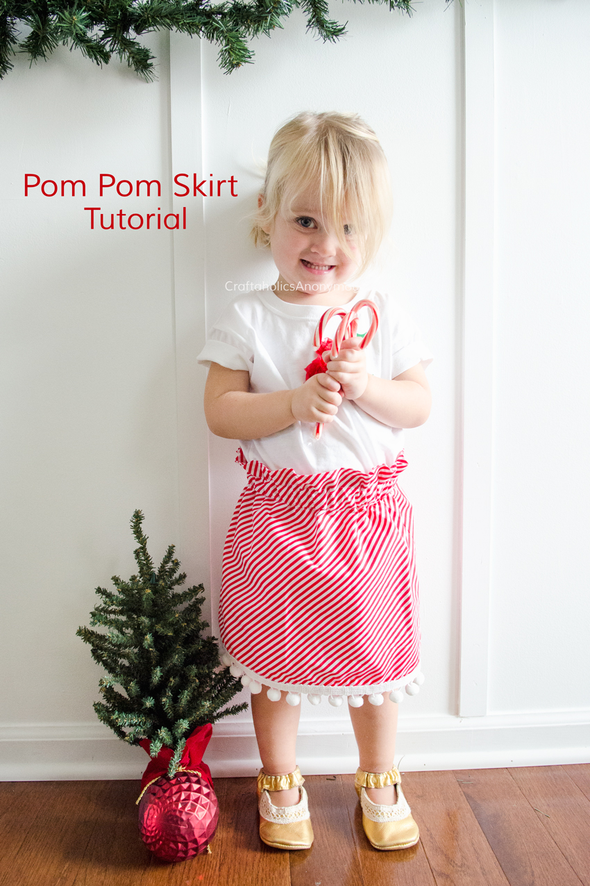 Easy Pom Pom Skirt tutorial. Whips up in about 1 hour! Free easy sewing pattern. Love the Christmas theme with Candy cane stripes and white poms. www.CraftaholicsAnonymous.net