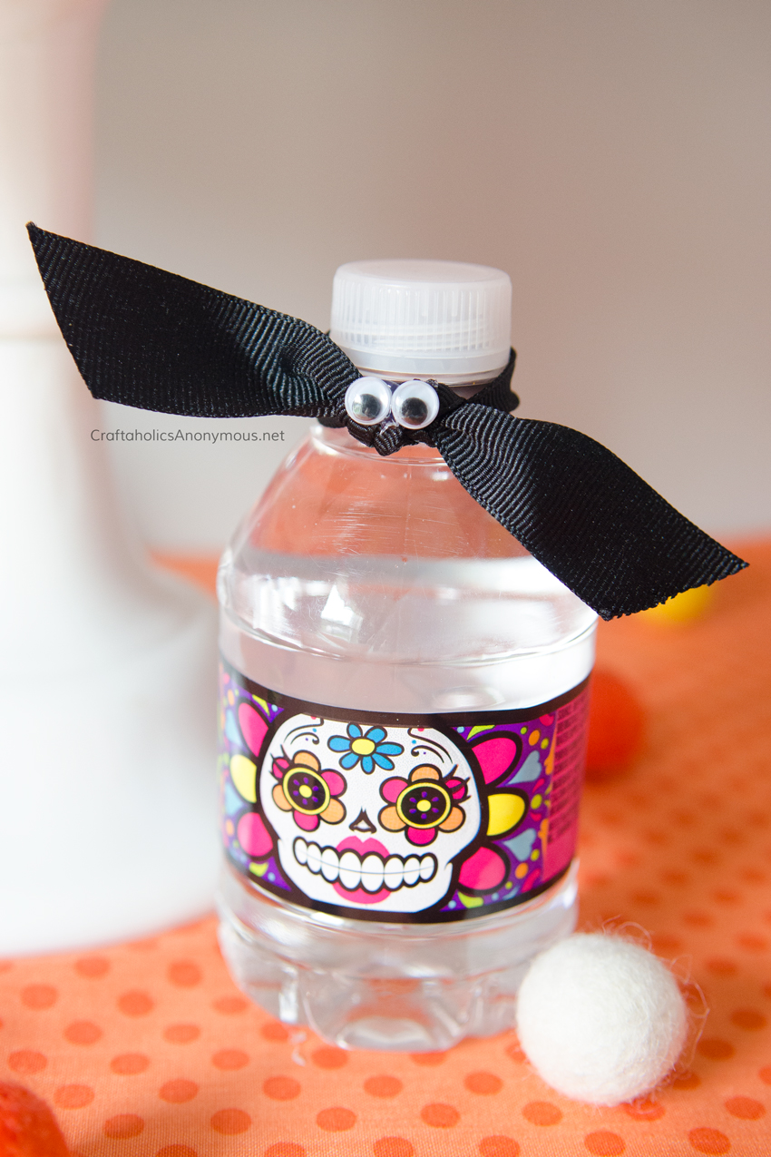 Bat Halloween water bottle toppers. Super easy! Just use googly eyes and black ribbon.