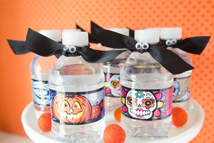 Halloween bat water bottle toppers. Super easy! Just use googly eyes and black ribbon.