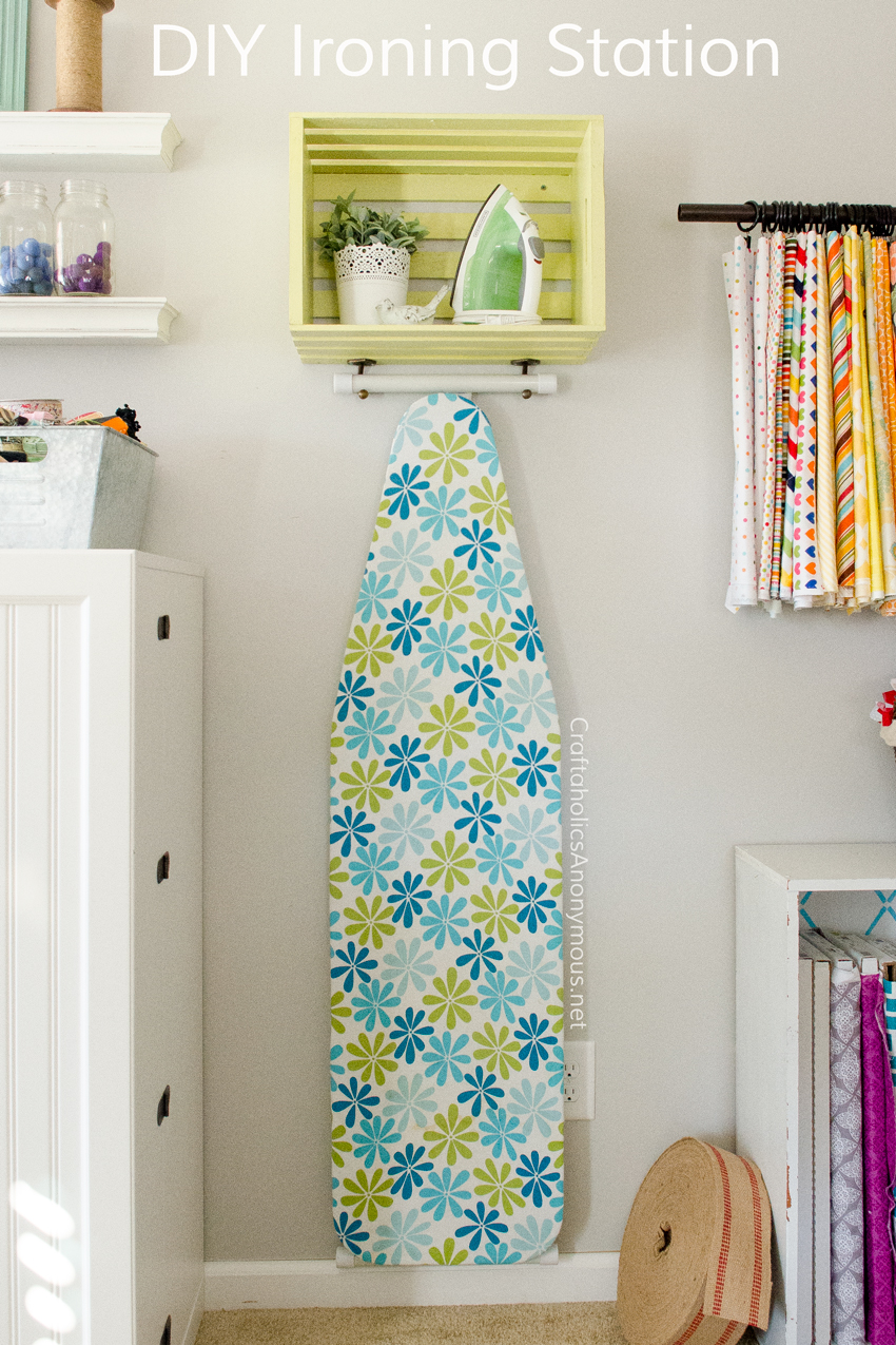 DIY Ironing station made with a wood crate and hooks