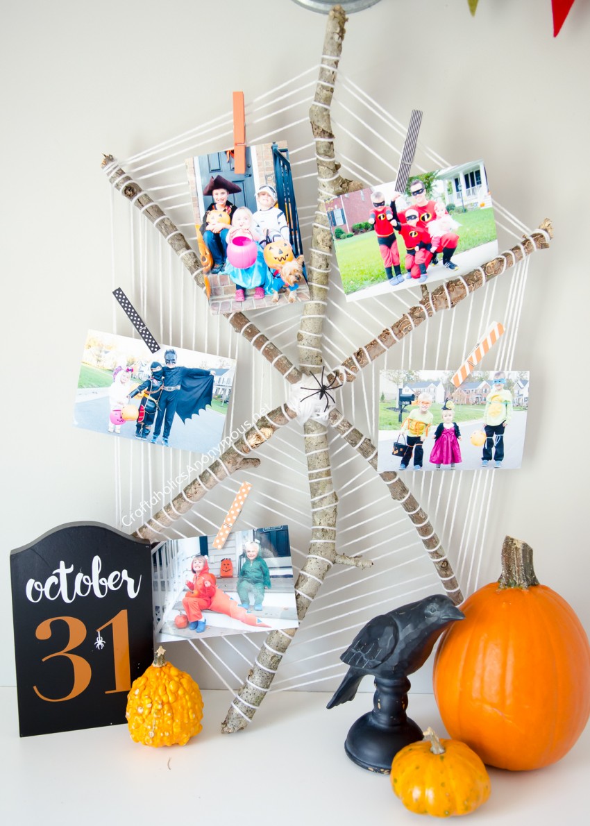 DIY Halloween Spider Web Photo Display :: perfect to show off previous Halloween costumes!